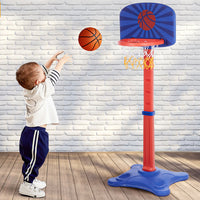 Child Playing with Adjustable Kids Basketball Hoop Set Indoors